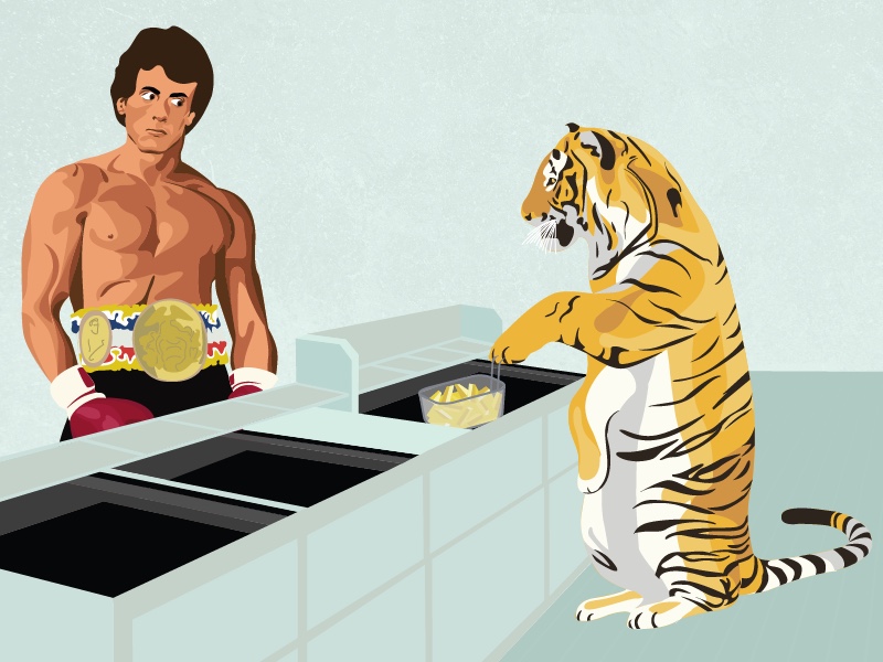 A tiger stands at a deep fryer while Rocky looks on.