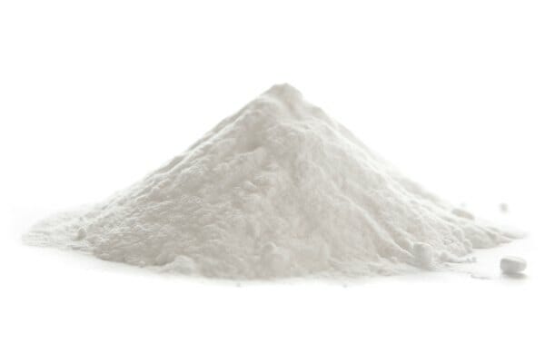 A mound of Baking Soda on a white background that looks like a snow-covered mountain.