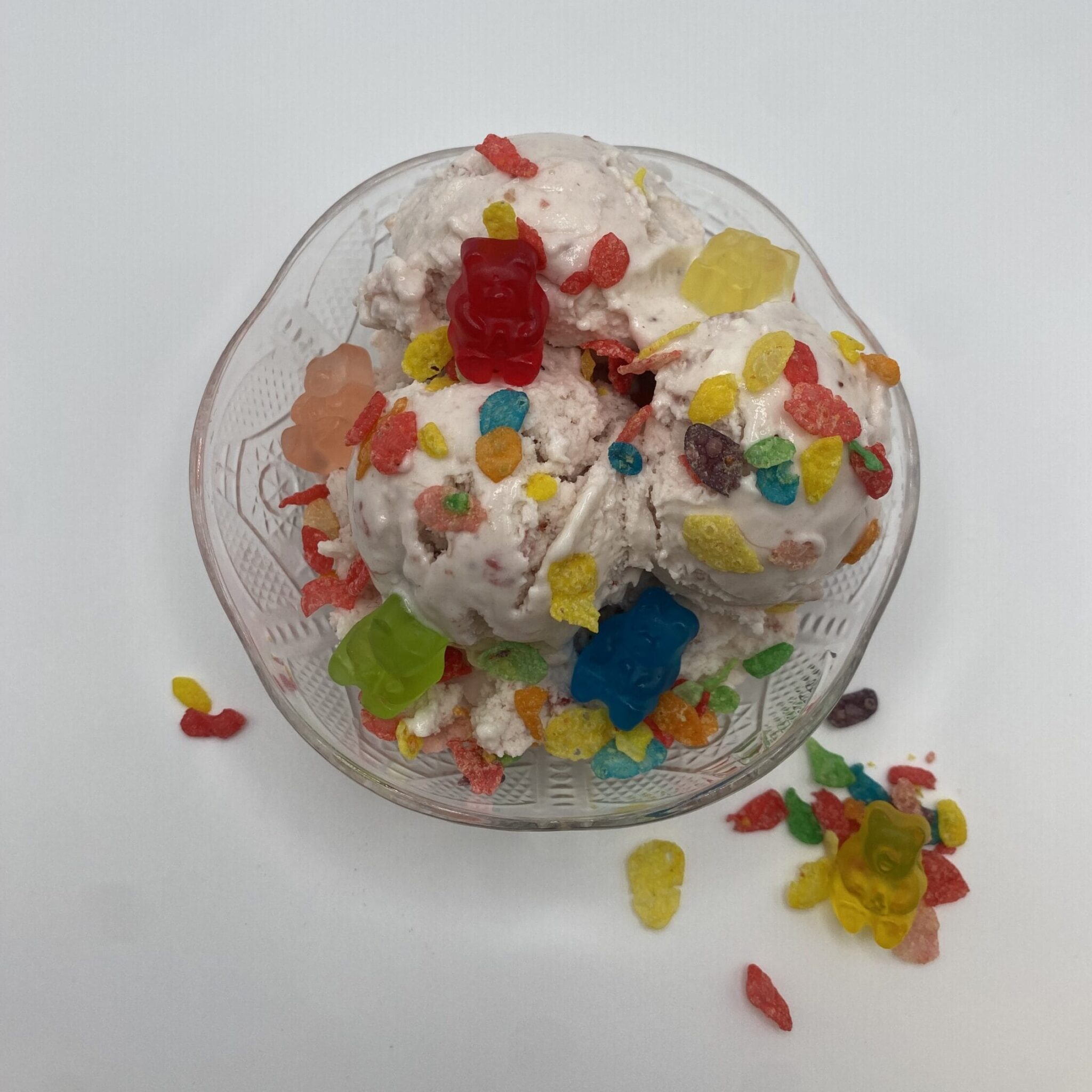 Ice cream bowl with strawberry ice cream, crispy fruit flavored rice cereal, and gummy bears