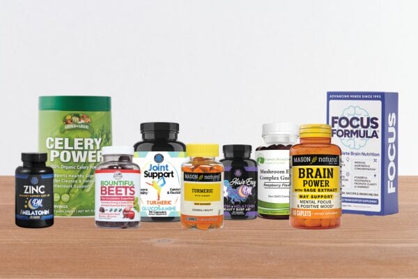 Variety of supplement bottles on a kitchen counter