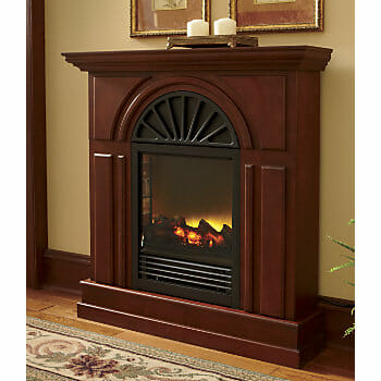 A lit vintage-looking electric fireplace in cherry wood, with an arched front.