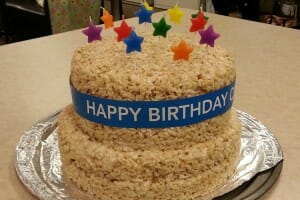 Rice Krispies Treat layered Birthday cake with multicolor star candles.