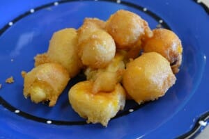 A bright blue plate with fried Wisconsin Cheese Curds.