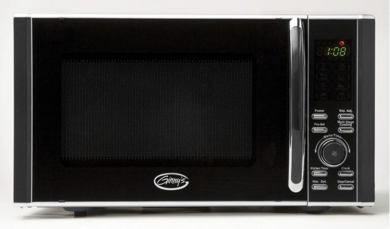 A black and chrome Ginny's brand microwave oven.