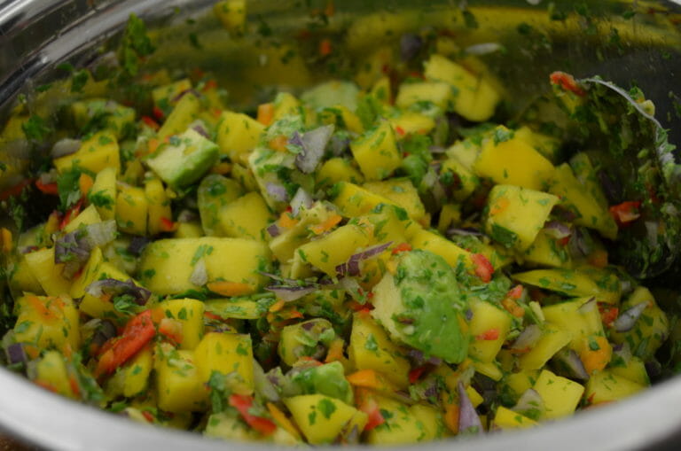 Close-up of a bowl of colorful Mango and Avocado Salad.