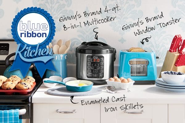 A blue and white kitchen with Ginny's brand small appliances, a skillet, blueberry muffins, eggs, and a knife set.