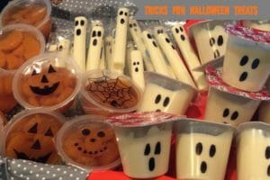 Tricks For Halloween Treats - Purchased snack cups with black marker drawings of Jack-o-Lantern and ghost faces.