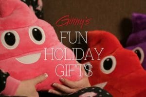 Ginny's Fun Holiday Gifts - Pink, red, and purple Poopie pillows with smiling faces.