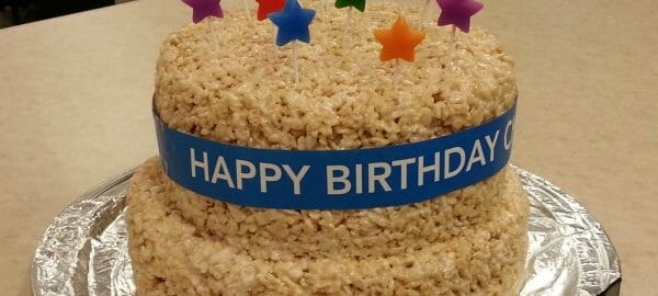 Rice Krispies Treat layered Birthday cake with multicolor star candles.