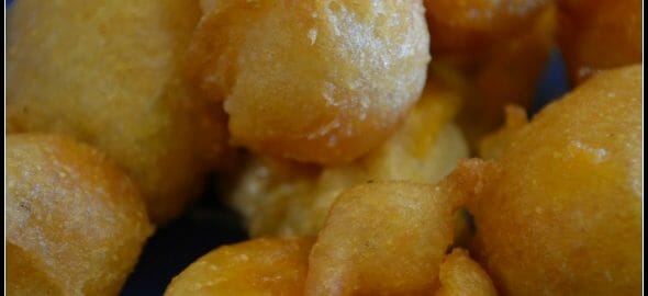 Wisconsin Cheese Curds - A bright blue plate with fried Wisconsin Cheese Curds.