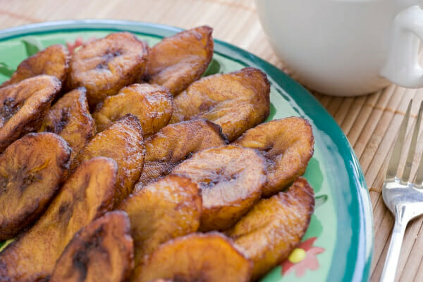 A blue floral plate filled with fried banana slices.